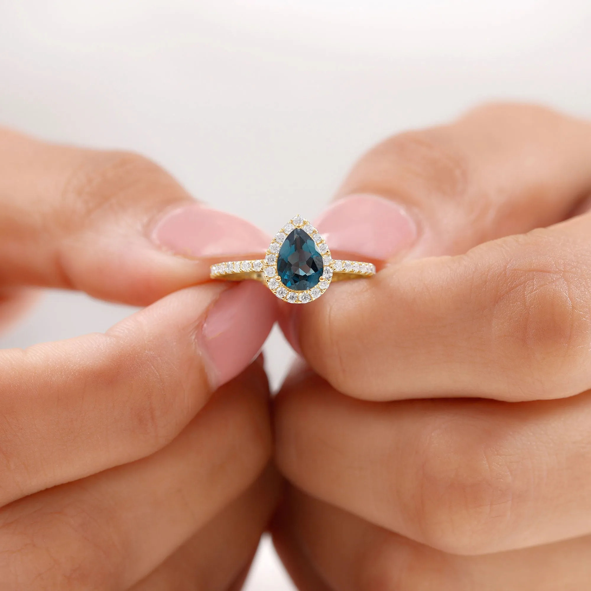 Pear Shape London Blue Topaz and Diamond Halo Ring